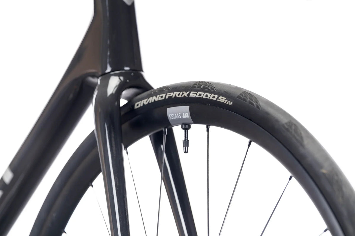 Suncrest Pro front tire marked Grand Prix 5000 S, close-up at the fork crown