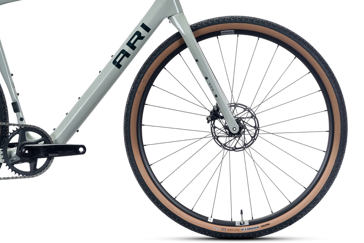 Front wheel, disc rotor and fork of the Shafer 2.0 Elite gravel bike with Ari downtube logo