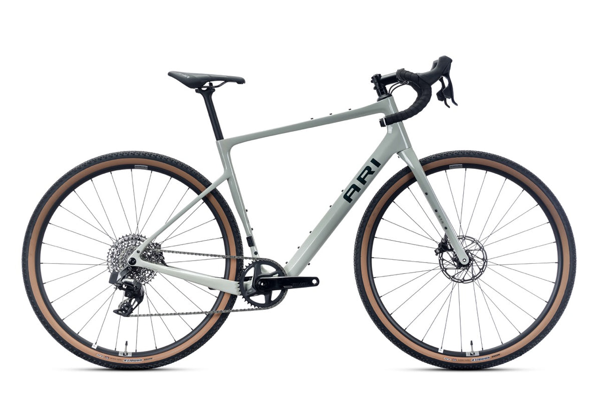 Ari Shafer 2.0 Elite gravel bike in sage gray with tan-wall tires, drive-side view
