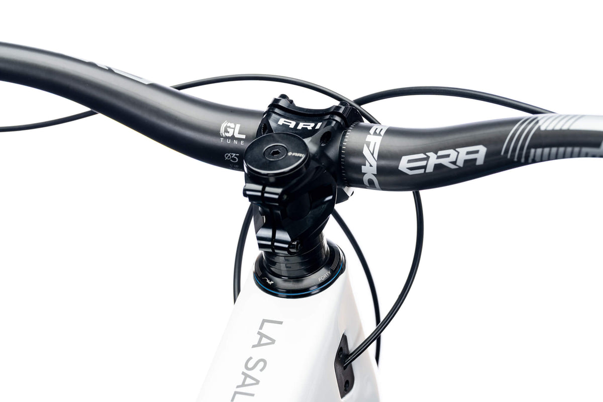 White Ari La Sal frame cockpit with an Era handlebar and black stem, top view