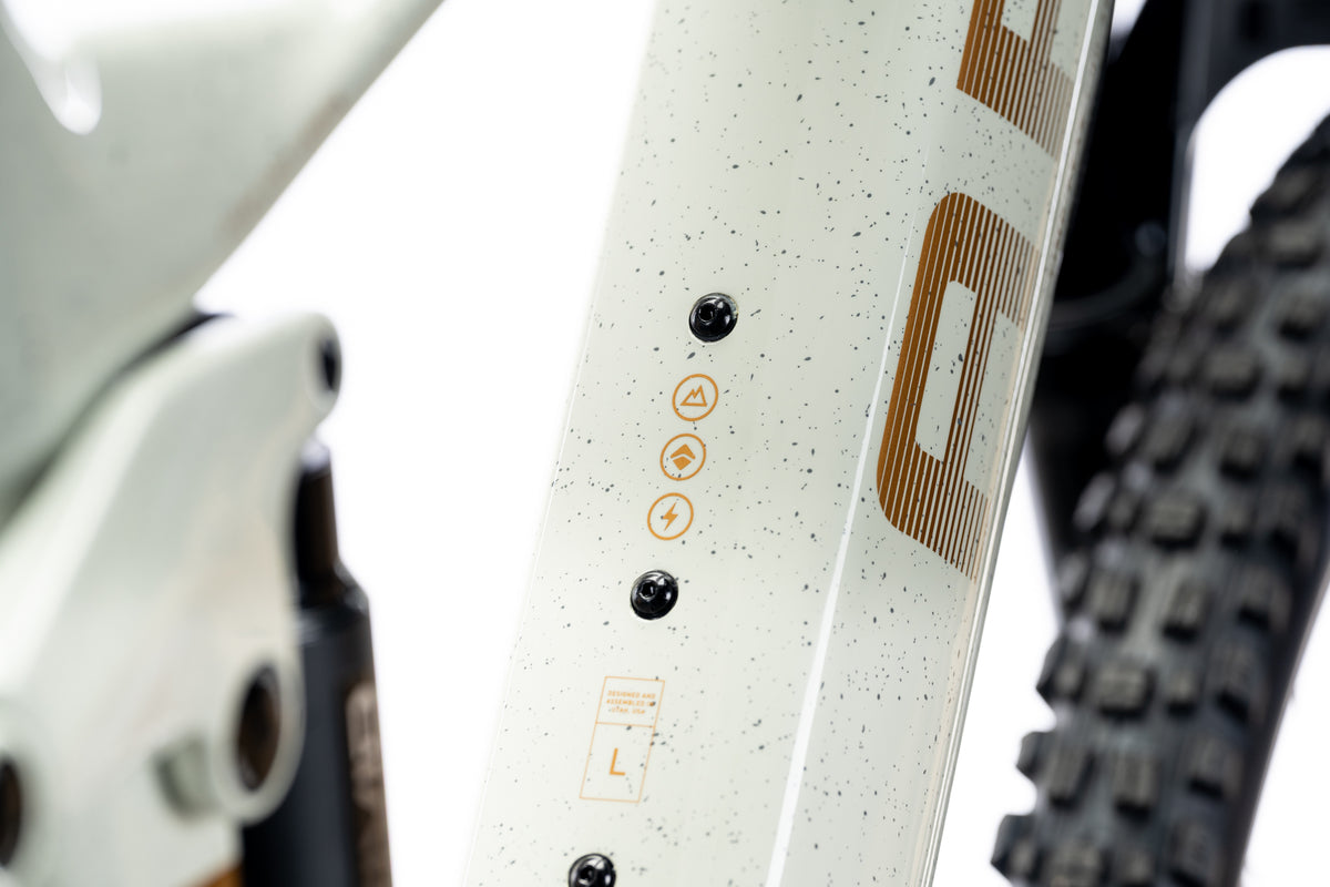 Speckled pale green Timp Peak down tube with a bronze Ari decal and frame size label