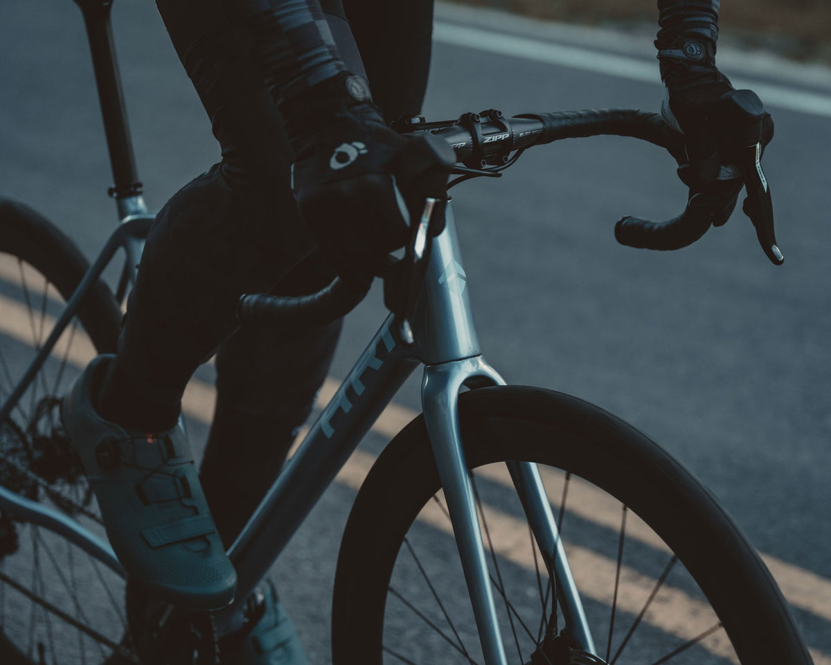 Gloved hands on the Suncrest cockpit and Zipp stem