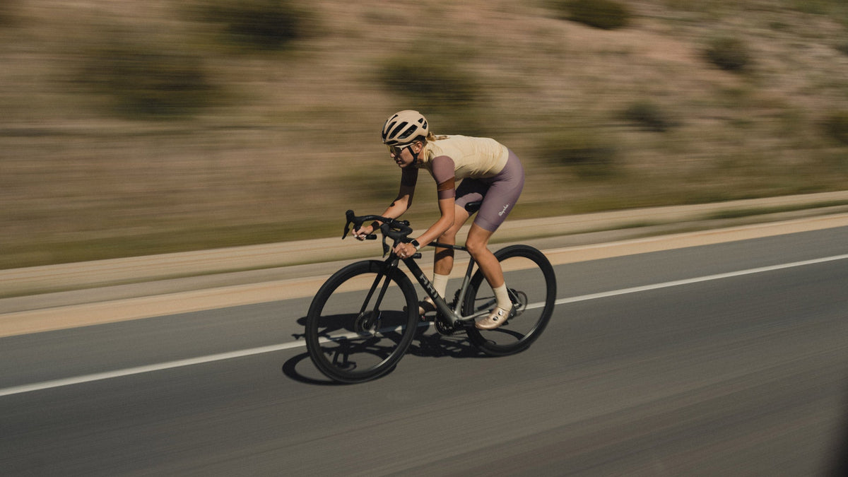 Rider on a dark Suncrest speeding along a desert road