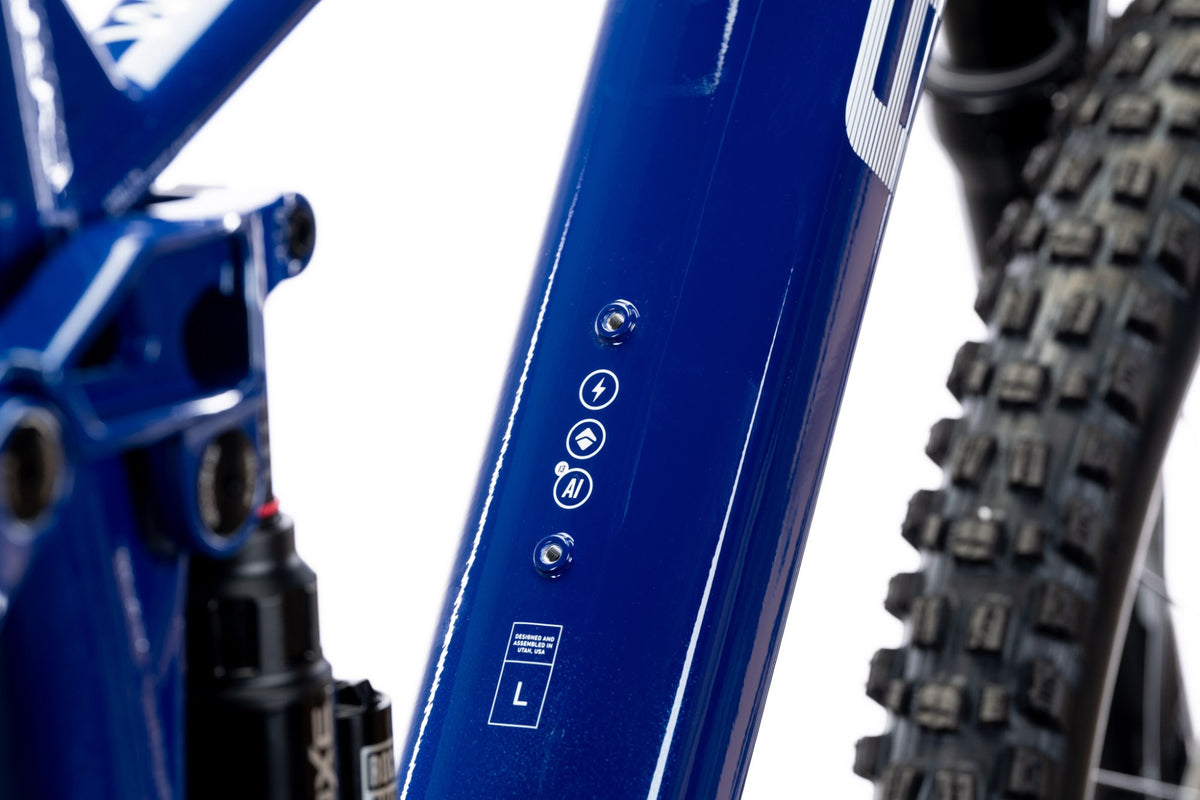 Designed and assembled in Utah badge on the blue Wire Peak down tube
